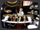 6 year old kid plays drums like a pro.